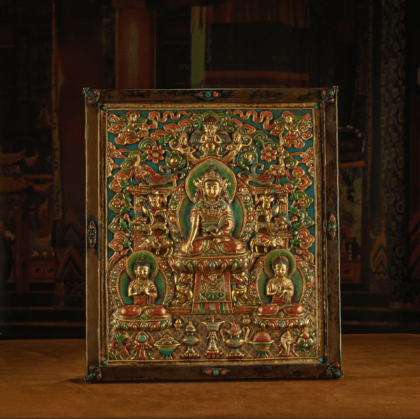 1 RADIANCE OF COMPASSION – 19TH CENTURY GILT COPPER JOWO BUDDHA WALL THANGKA